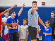 Former Penn State basketball standout John Harrar speaks at Bishop McDevitt boys basketball camp